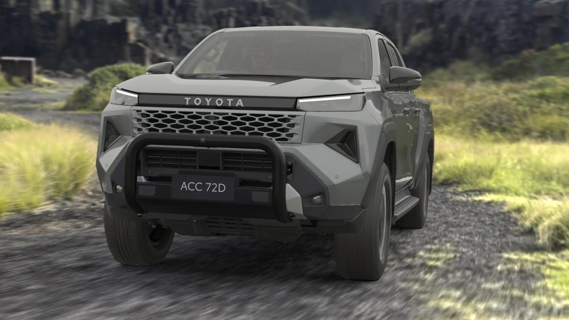 A Toyota HiLux SR5 double-cab ute in Ash Slate with a Matte Black Nudge Bar, driving down an unpaved road. A slight motion blur conveys speed.